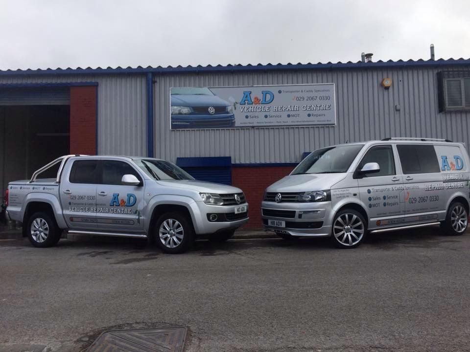 two vans parked infront of each other