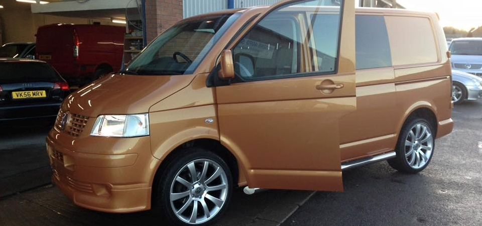 an orange van with an open door